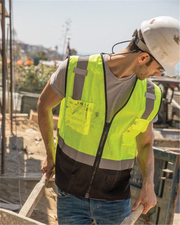 Construction worker wearing lime ML Kishigo Class 2 Black Bottom Vest - 1509